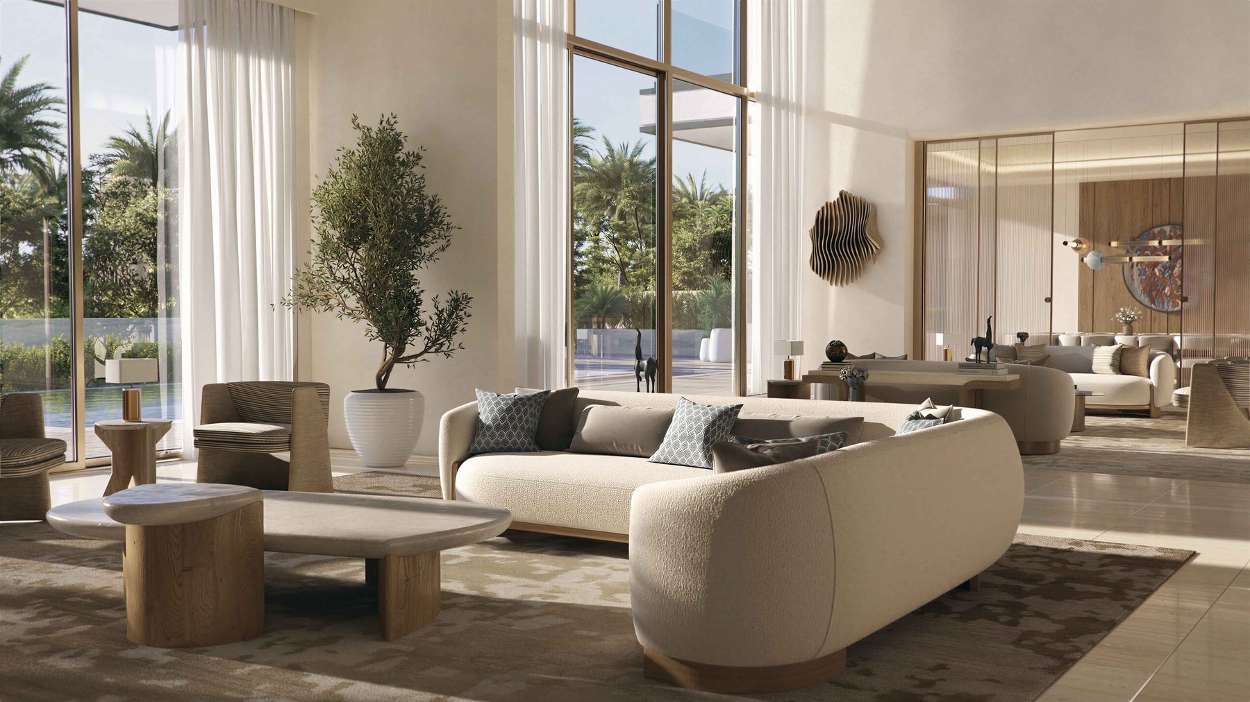 A double-height living room in a six bedroom villa, opening to the garden and pool