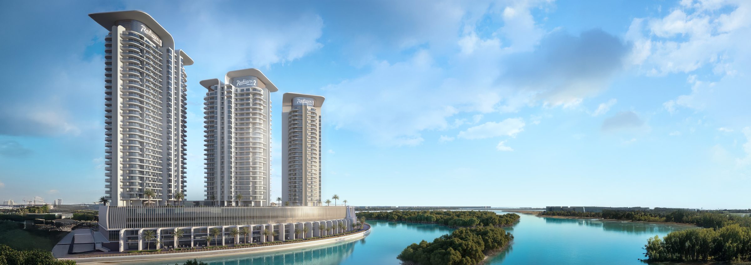 The three Radisson Residences towers on Al Reem Island seen across the mangrove channel