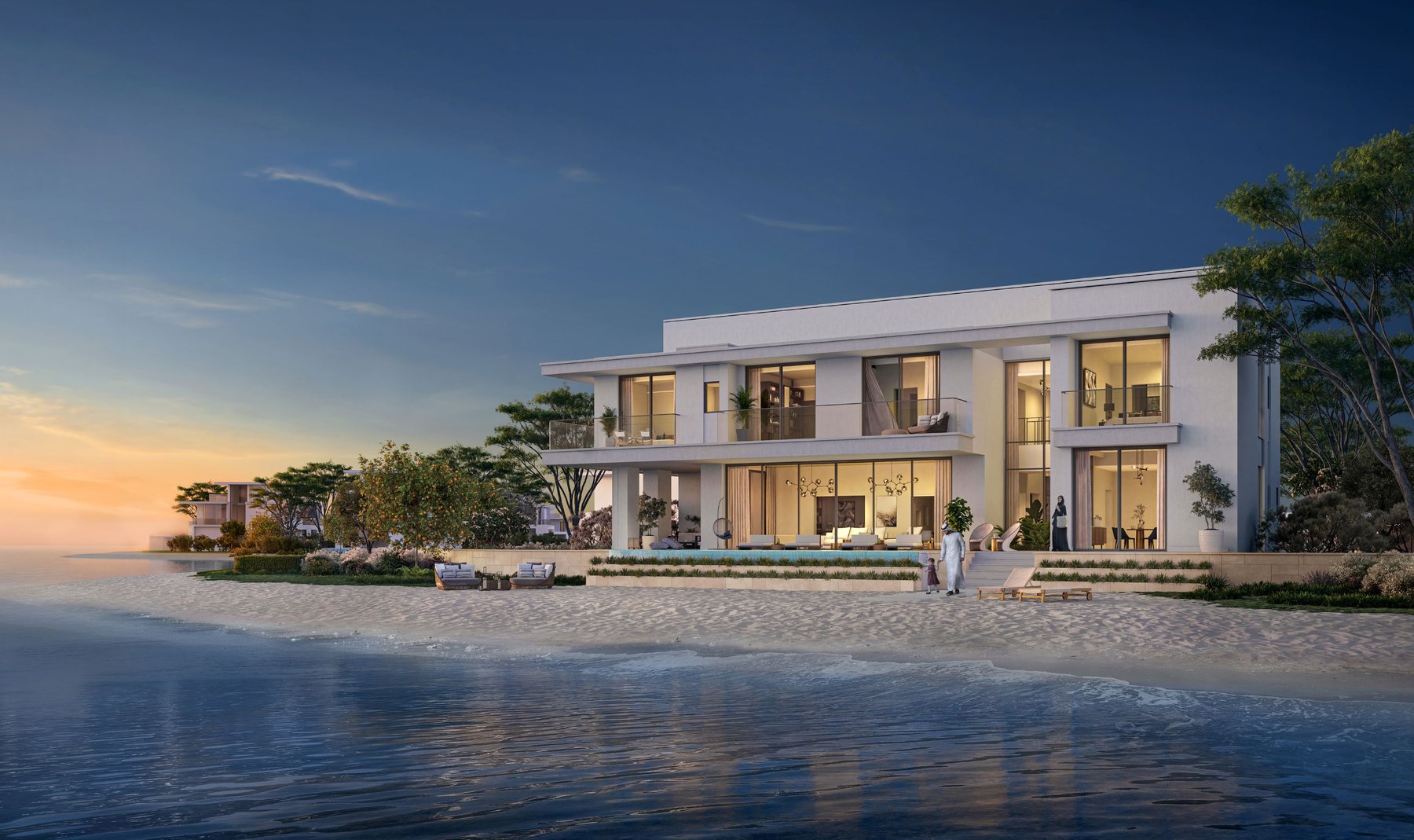 A waterfront villa at Ramhan Island at sunset, with the pool facing the beach