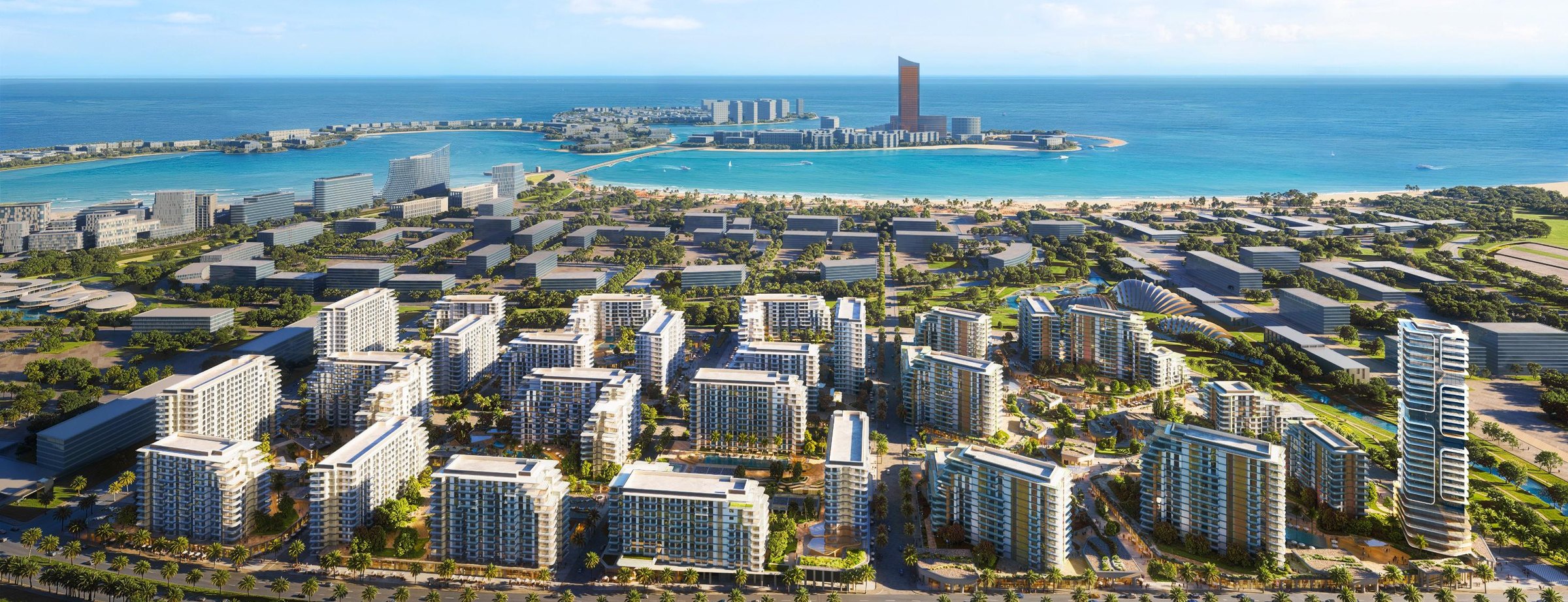 Aerial view of The Strand, with the central park spine and the Al Marjan coastline beyond
