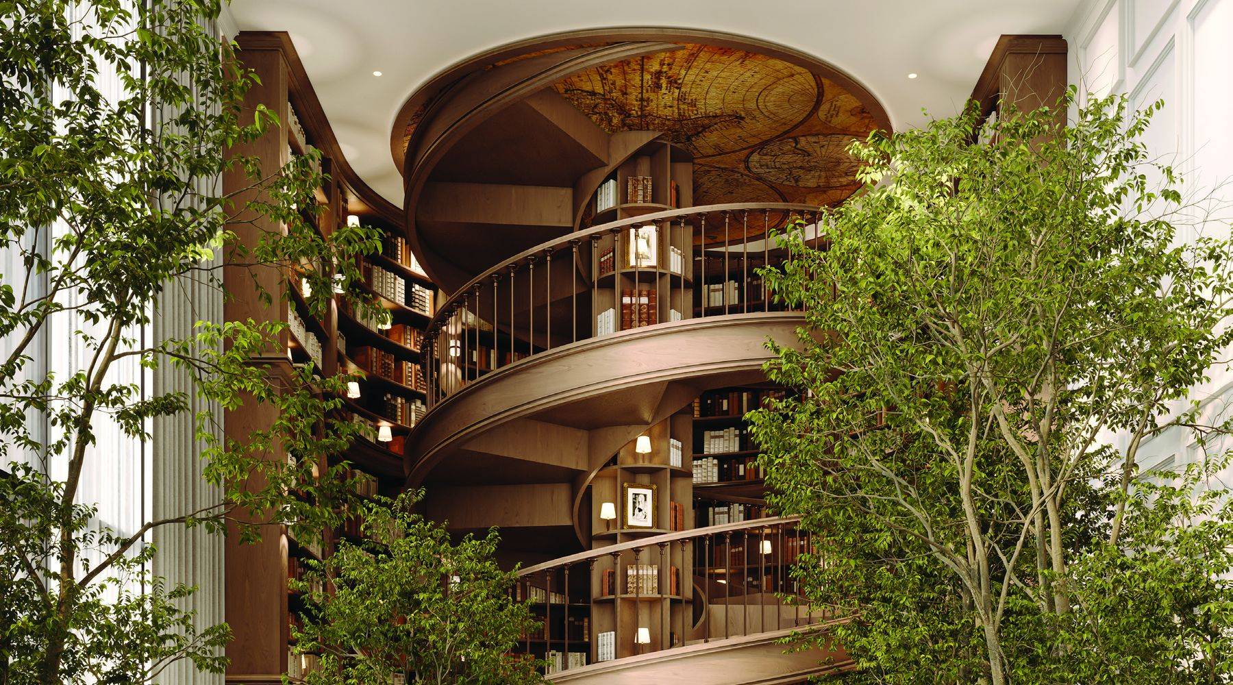 The two storey library at the entrance to The Archive, with a spiral stair rising through the bookshelves